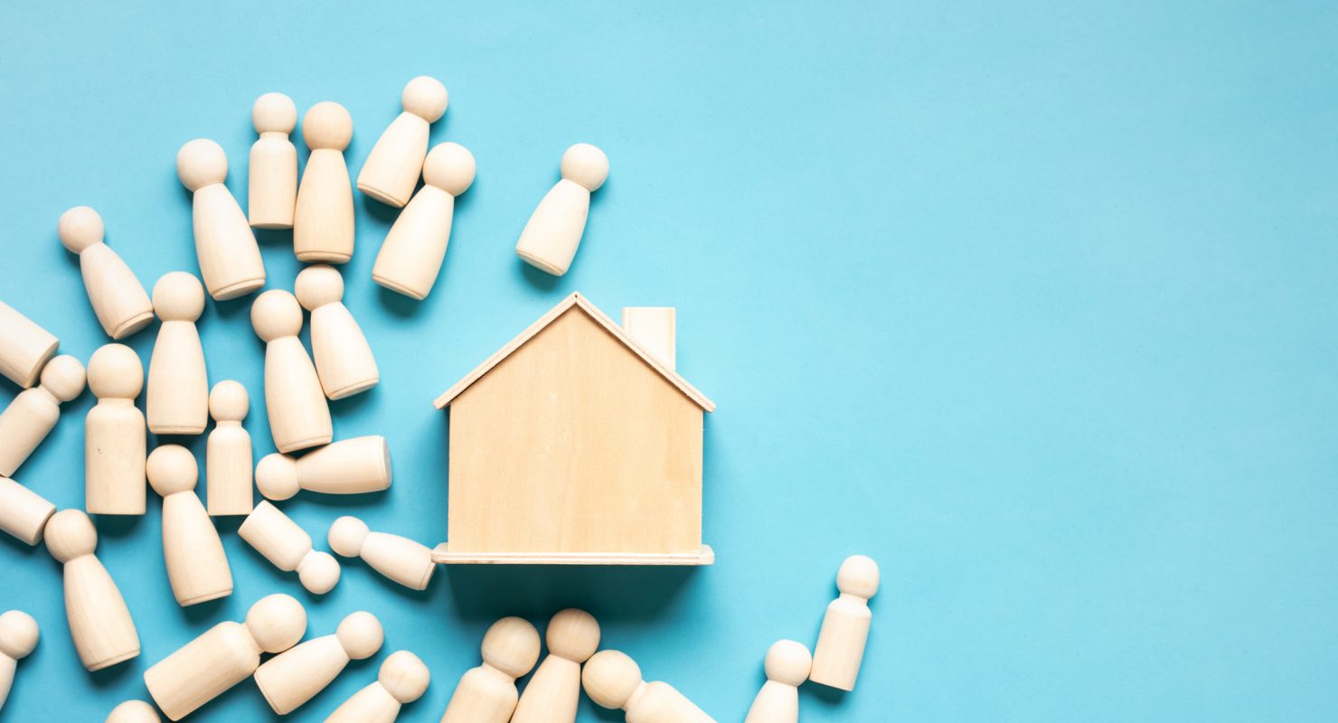 Group of many people wood model and home in structure population growth and  community, housing concepts.social panning management and environment ideas