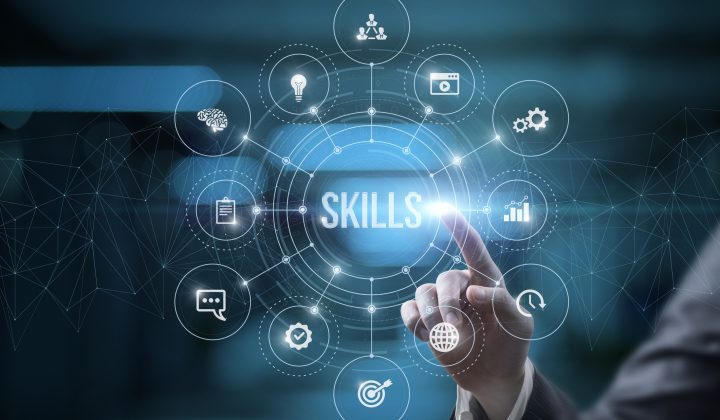 Businessman on virtual computer screen click on skills on blurred background.