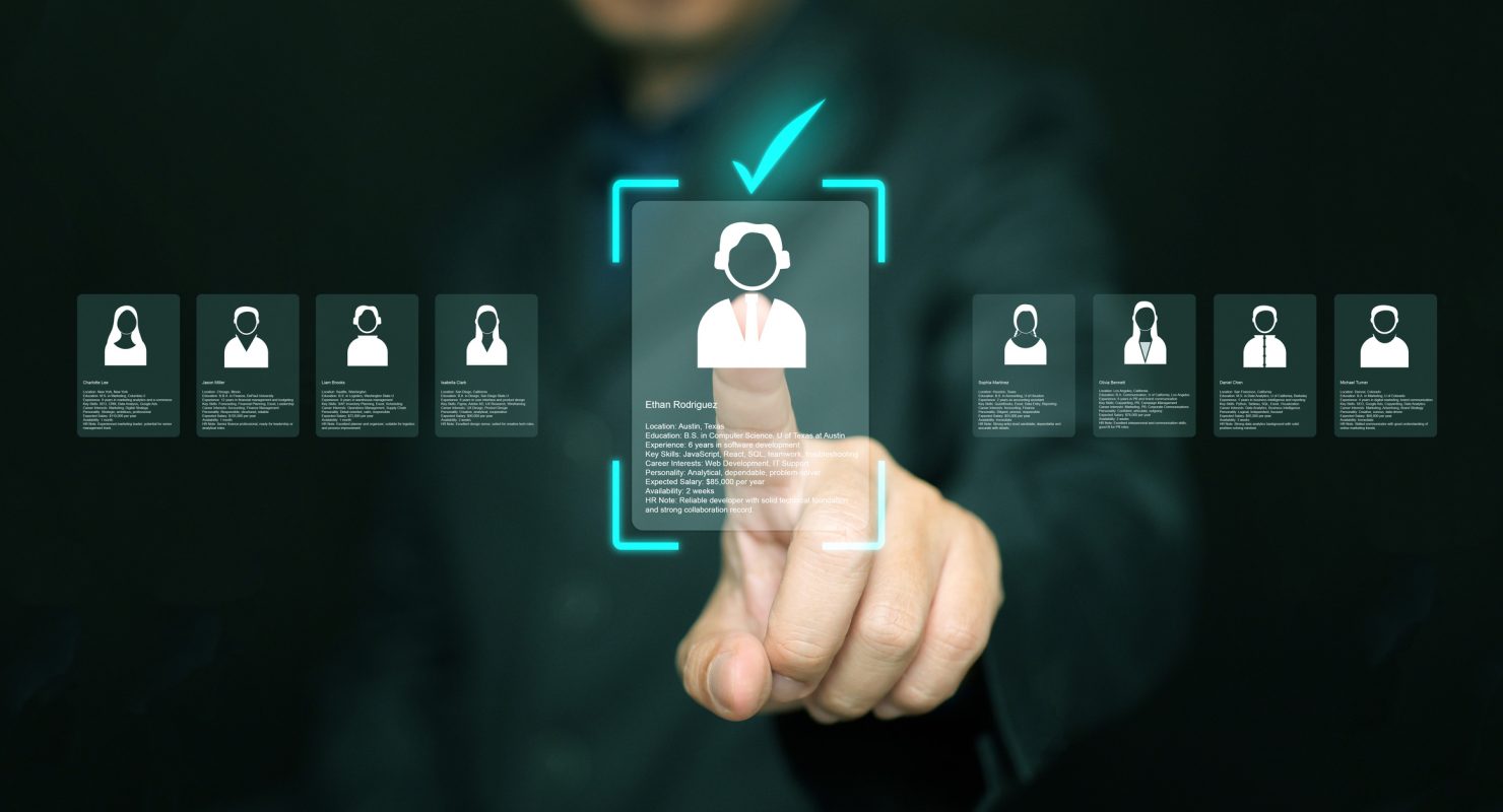 Human resources manager analyzing applicant profiles on virtual screen. Modern concept of digital recruitment, AI candidate selection, HR analytics, and smart hiring technology in business.
