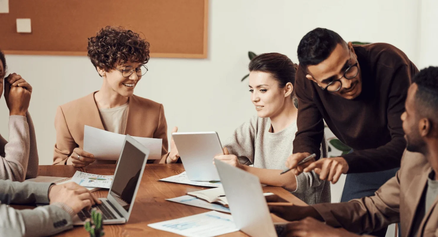 Corporate people around a desk